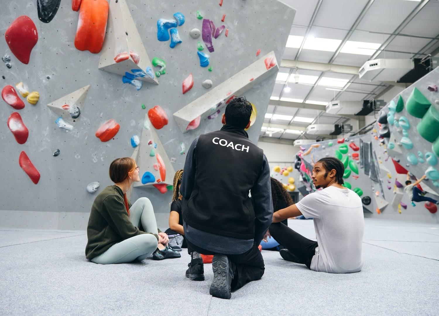 Coach working with children at a GCS accredited climbing centre